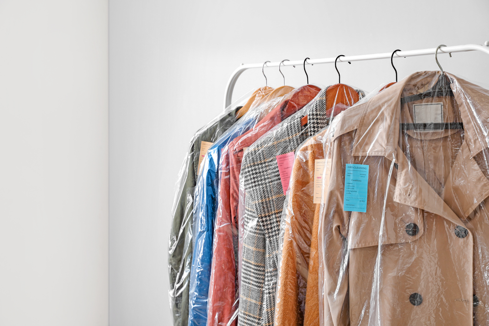 Dry Cleaned Clothes On Rail