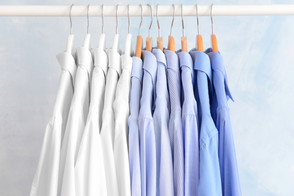 Rack,With,Clothes,After,Dry-cleaning,On,Light,Background