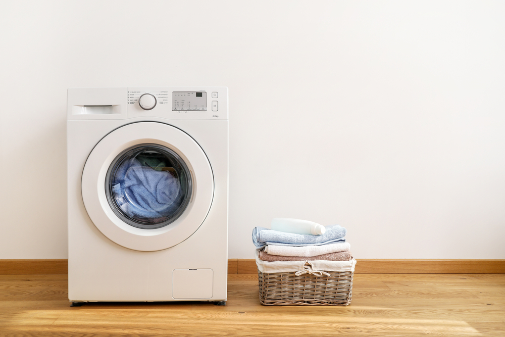 Washing,Machine,,Washing,Gel,And,Laundry,Basket,On,White,Background